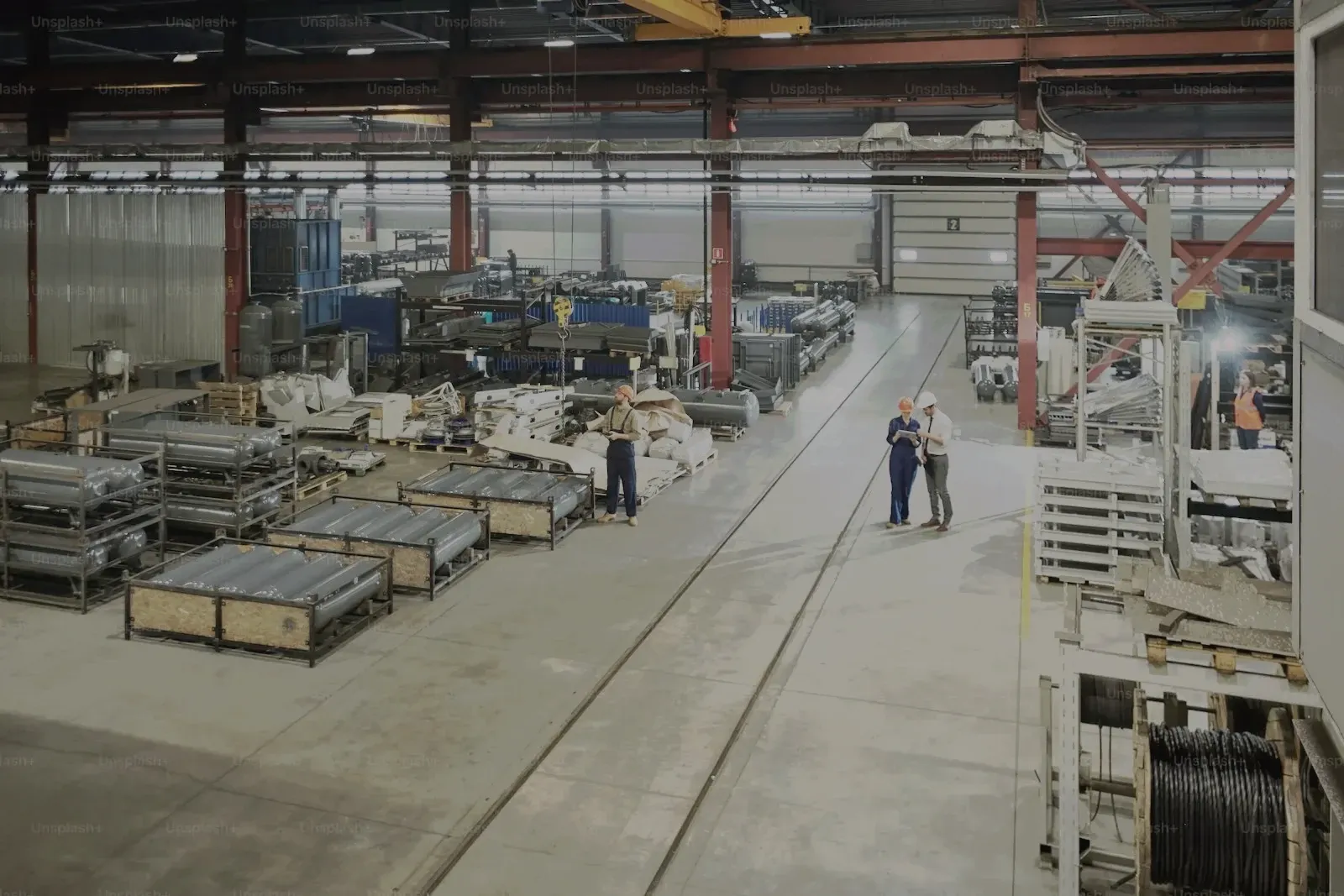 Factory floor with machines and two workers