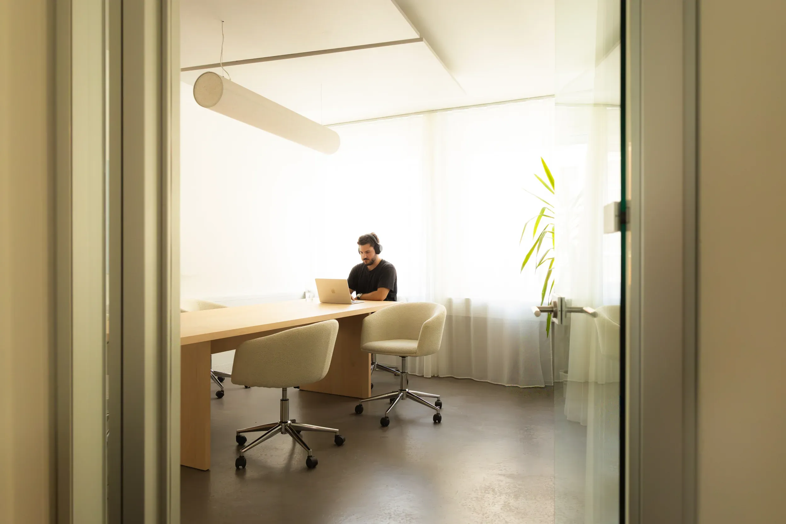 A Cerrion engineer working in the meeting room