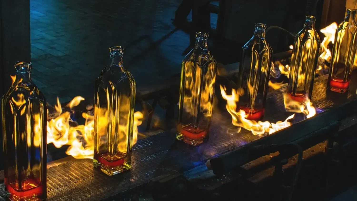 Glass bottles at the hot end of a production line
