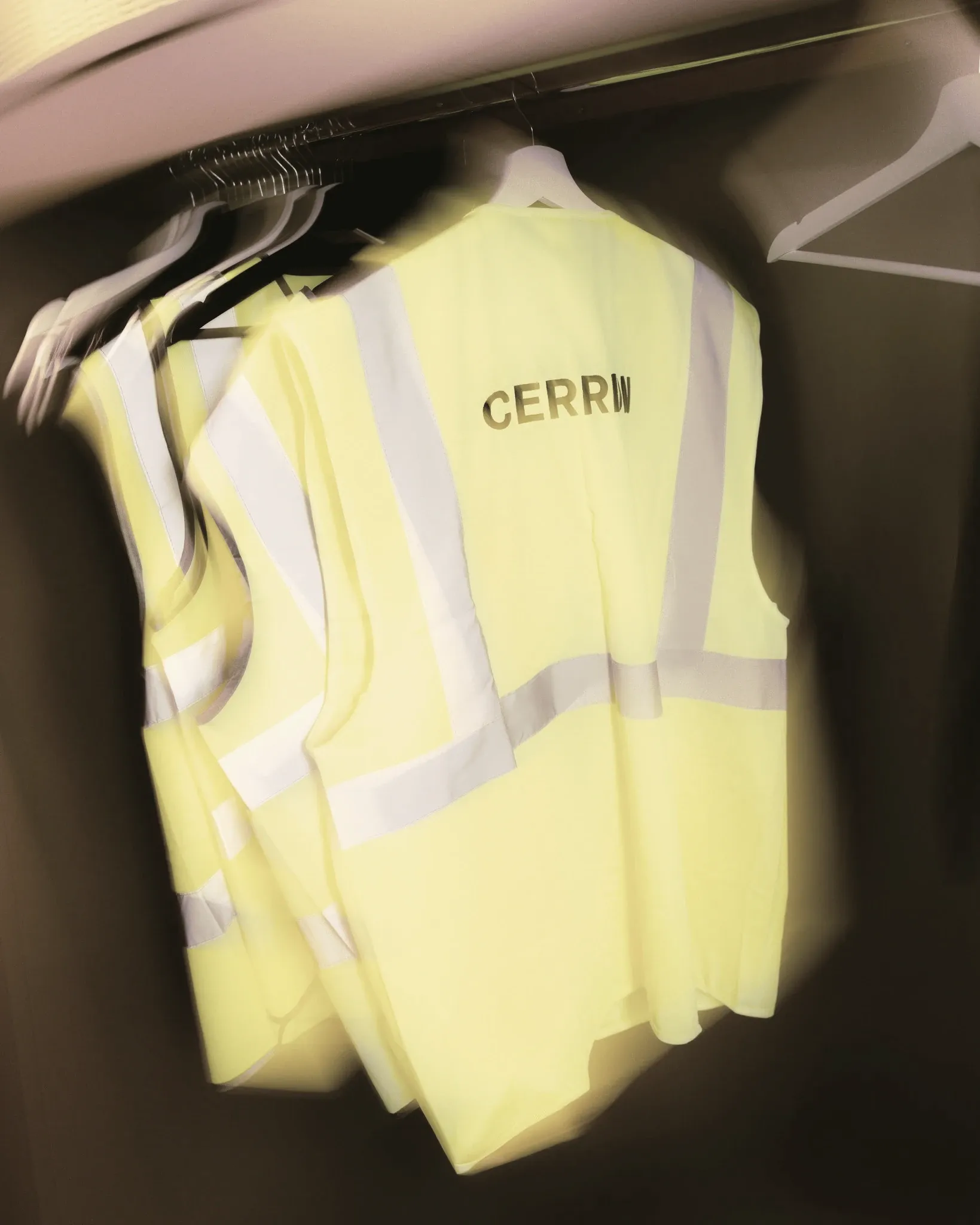 Cerrion safety vests hanging in a factory
